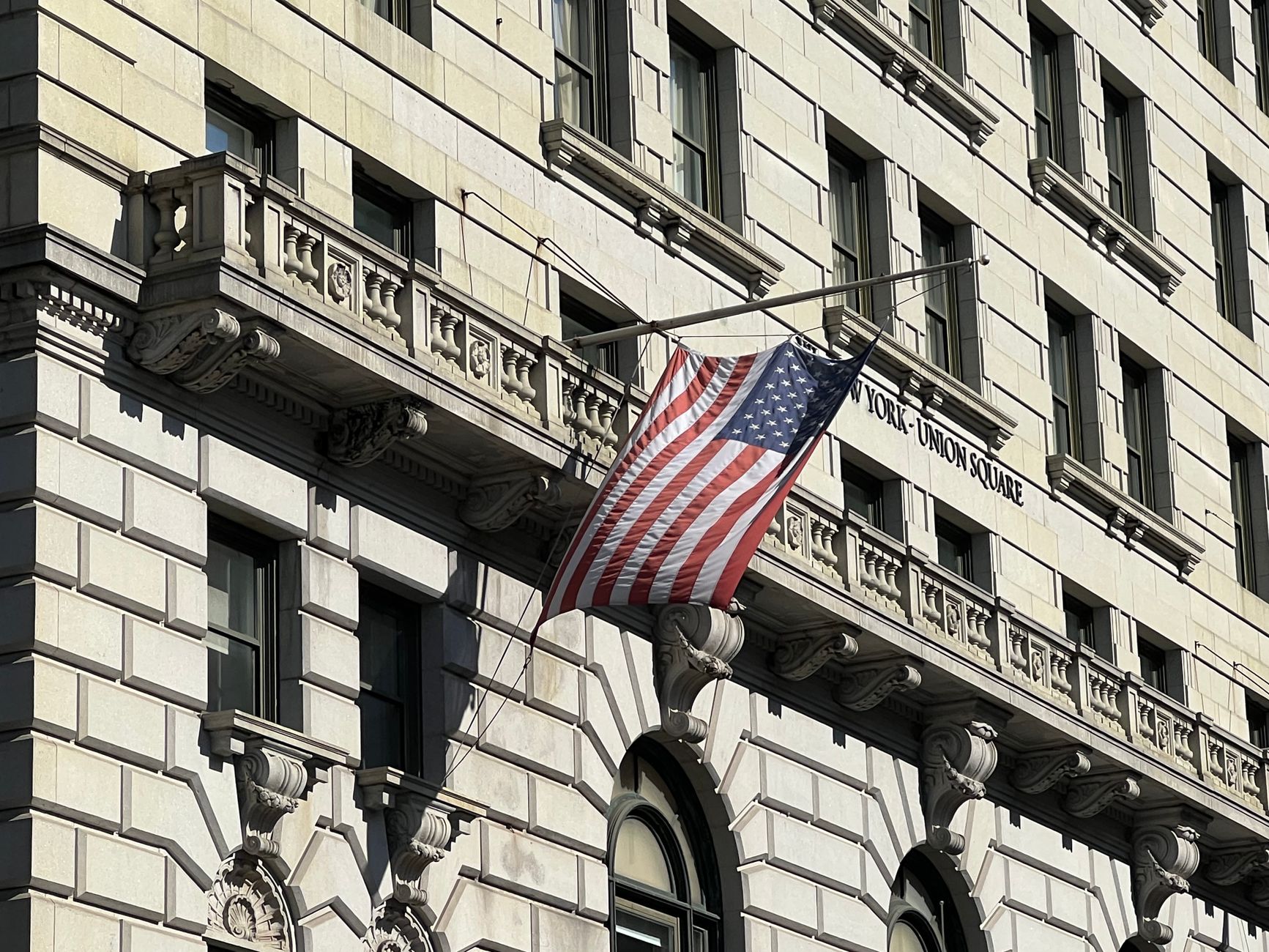 US Treasury building exterior with American flag